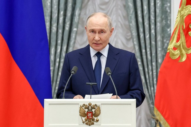 In this pool photograph distributed by the Russian state agency Sputnik, Russia's President Vladimir Putin gives a speech during a ceremony to present state awards in the defence industry sector at the Kremlin in Moscow on September 18, 2026. (Photo by Alexander KAZAKOV / POOL / AFP via Getty Images)