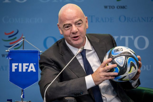 (FILES) FIFA President Gianni Infantino holds an official ball of the 2023 FIFA Women's World Cup during the "Making trade score for women!" discussion on the use of football as a tool for trade and development at the WTO headquarters in Geneva, on May 1, 2023. FIFA has accused European football's governing body UEFA of a "misinformation" campaign in its bid to access documents related to Gianni Infantino's plan to sell off parts of the World Cup. In FIFA's response in a court case in Florida, it says UEFA's attempt to force the world body to hand over the documents is also an attempt to "influence" next year's FIFA presidential election. (Photo by Fabrice COFFRINI / AFP via Getty Images)