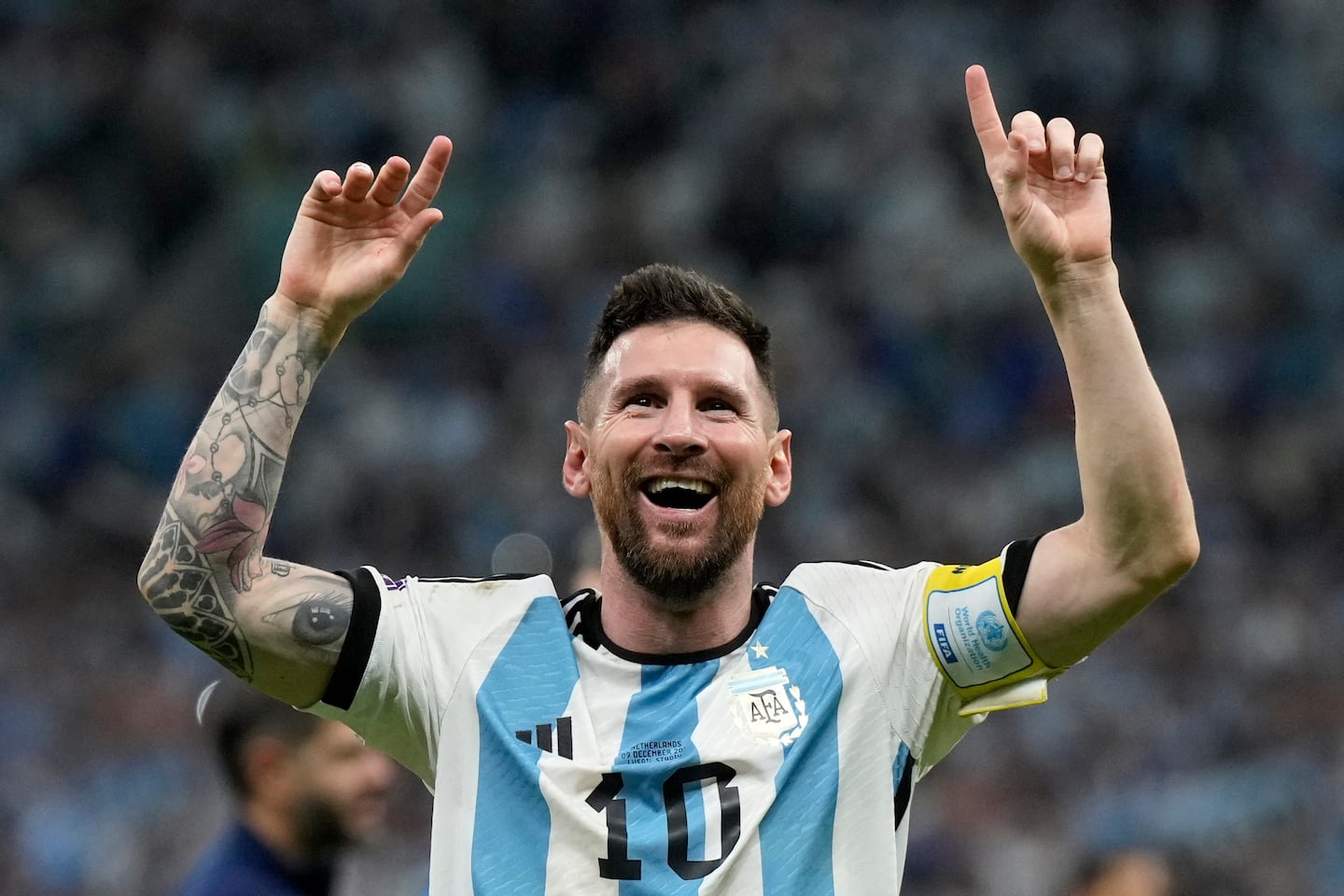 Argentina's Lionel Messi celebrates at the end of the World Cup quarterfinal soccer match against the Netherlands in Lusail, Qatar, Dec. 10, 2022.