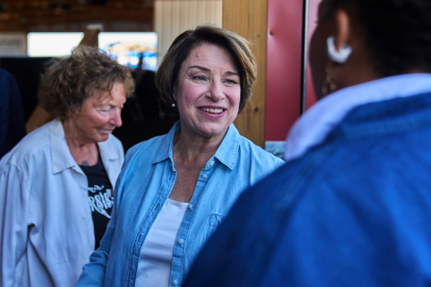 U.S. Sen. Amy Klobuchar talks with people.