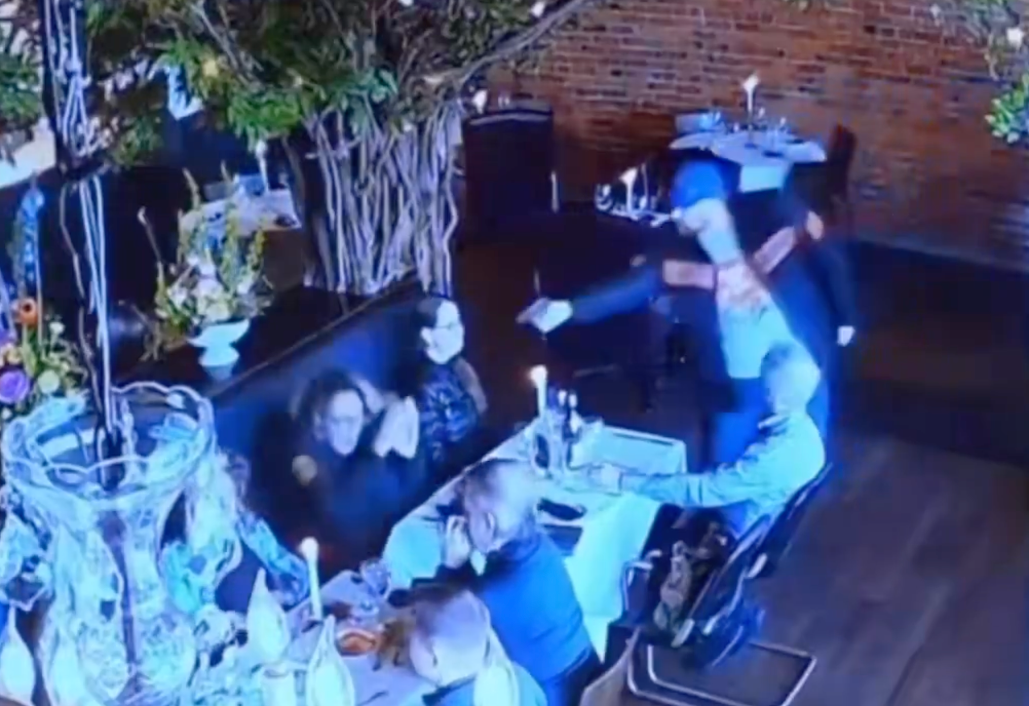 A waiter tackled an armed man who tried to shoot his ex-wife in a crowded Ohio restaurant