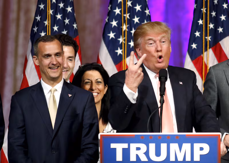 Donald Trump's campaign manager Corey Lewandowski (L) looks on as Trump speaks about the results of the Florida, Ohio, North Carolina, Illinois and Missouri primary elections during a news conference held at his Mar-A-Lago Club in Palm Beach, Florida, U.S. on March 15, 2016.
