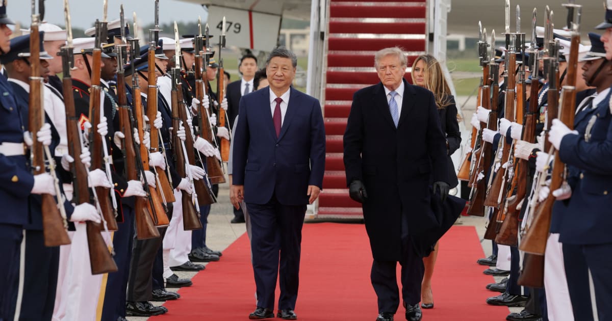 China's President Xi Jinping (L) and U.S. President Donald Trump arrive for a military review in the Rose Garden of the White House in Washington, DC, on September 24, 2026.