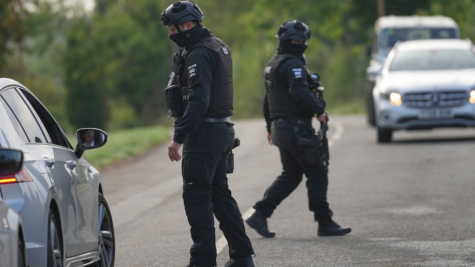 Police guard a road leading to RAF Fairford, in Fairford, England, Monday, Sept. 28, 2026.