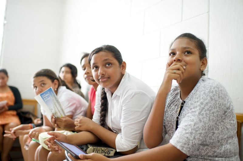 Young women in Ecuador participate in a class.