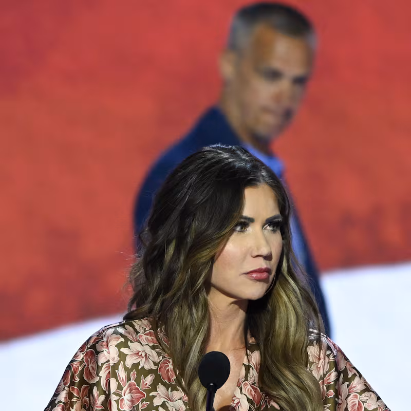 Kristi Noem takes part in a sound check as political commentator Corey Lewandowski looks on at the Fiserv Forum ahead of the 2024 Republican National Convention on July 14, 2024 in Milwaukee, Wisconsin.