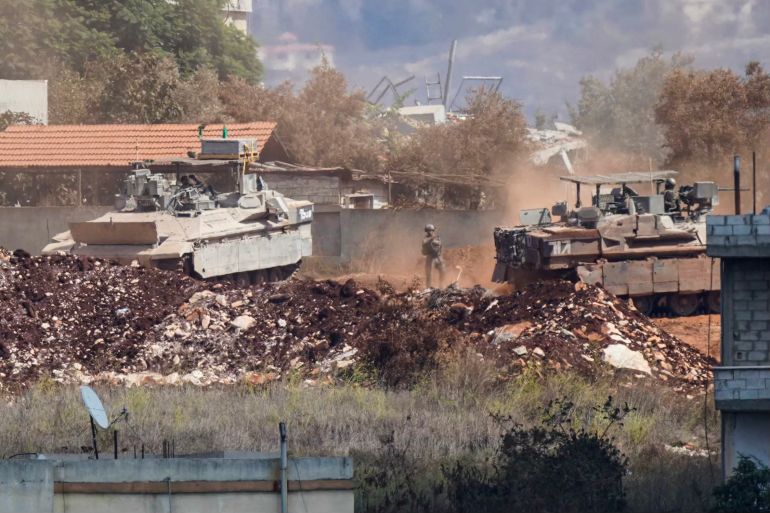A photograph taken from the southern Lebanese village of Zawtar al-Gharbiyah shows Israeli armoured vehicles manoeuvring in the nearby village of Zawtar al-Charkiyah on September 24, 2026.