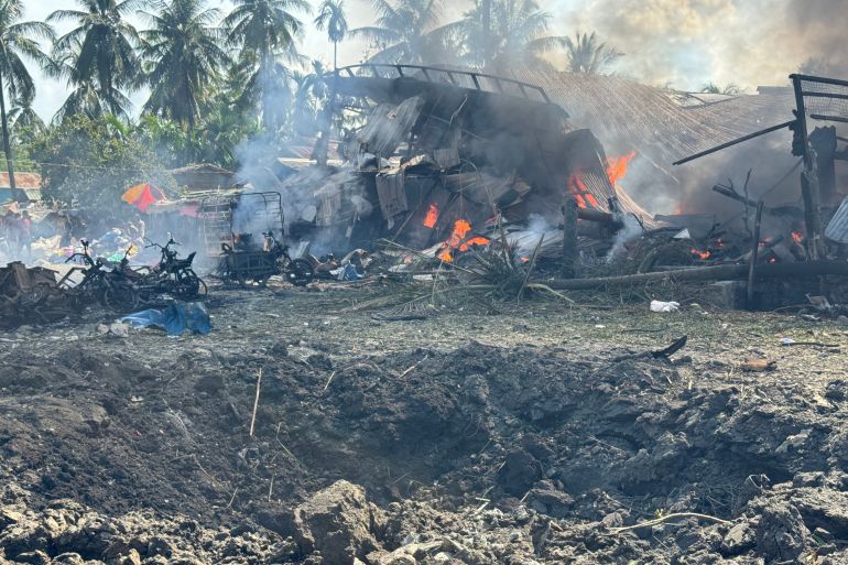Smoke billows from fires in a residential area following a Myanmar military air attack on a market and adjacent bridge in Kyauktaw, Rakhine state, September 28, 2026 [AFP]