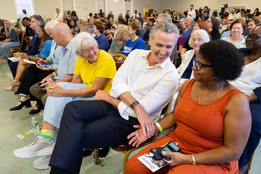 California Gov. Gavin Newsom shares a laugh with Dianne Kittrell, at right, during a campaign event at the Brookland-Lakeview Empowerment Center, Friday, Sept. 4, 2026, in West Columbia, SC.