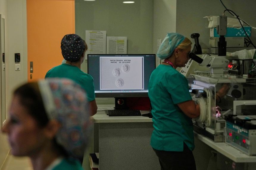 An image of the Raptis couple's embryo is displayed on a laboratory monitor as clinical embryologists work at a private IVF clinic in Athens, Greece, on Friday.
