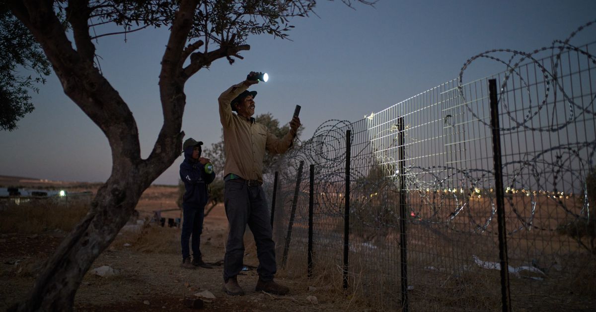 A flashlight and unseen settlers: Photographer conveys West Bank family's nightly watch in 1 photo :: WRAL.com