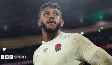 Courtney Lawes walks past fans after getting off a coach