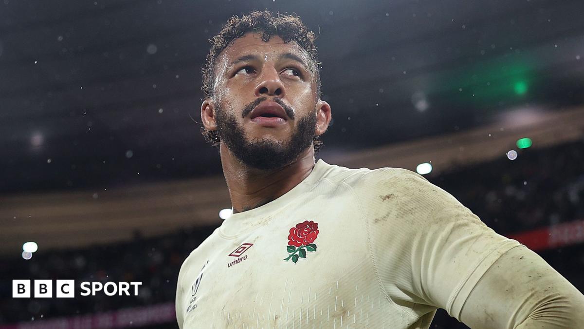Courtney Lawes walks past fans after getting off a coach