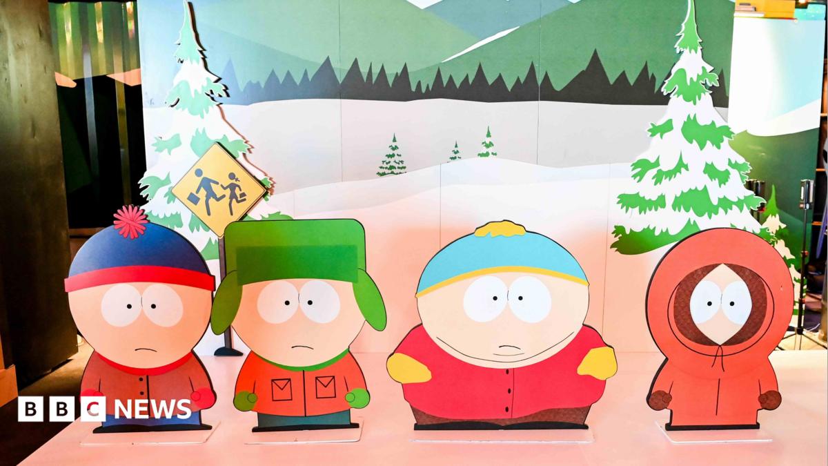 Characters from South Park TV show as cut-outs on a stage with a wintery backdrop.