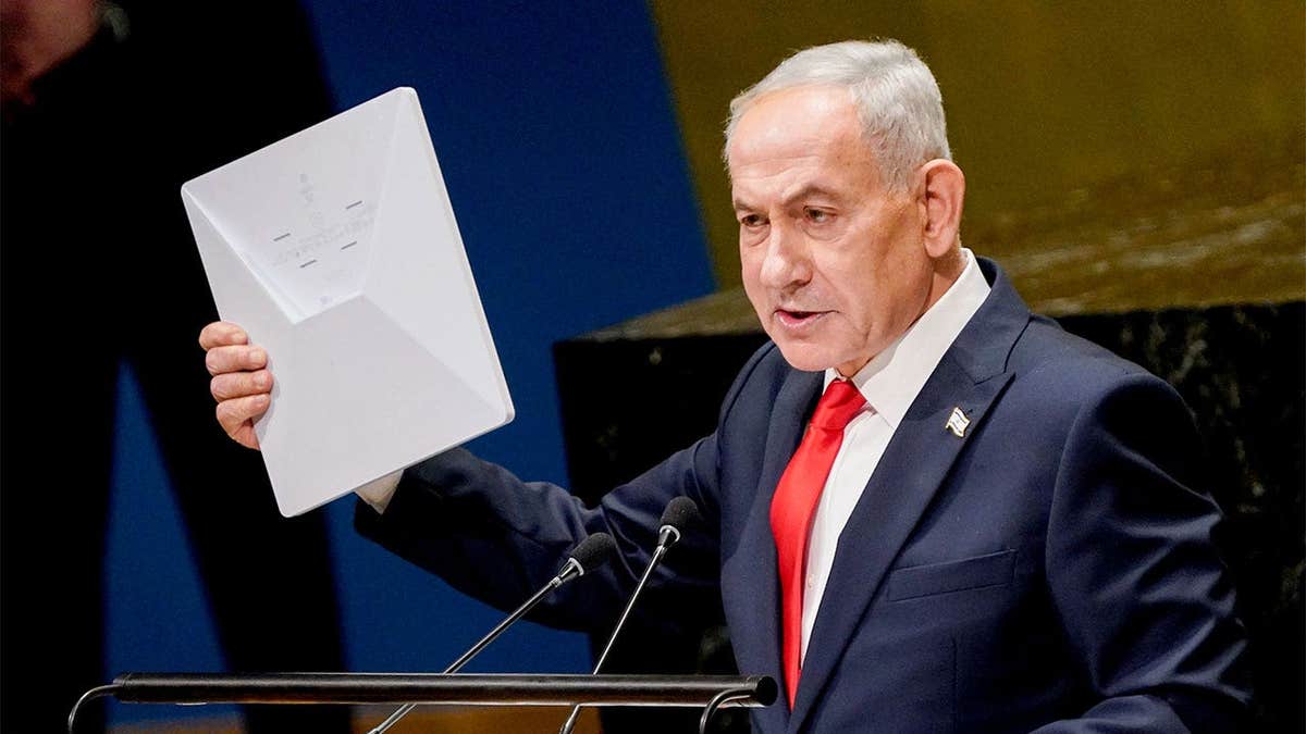 Israeli Prime Minister Benjamin Netanyahu holds a Starlink device during his U.N. General Assembly address in New York.