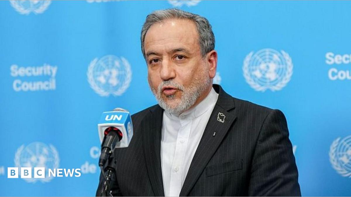 Iranian Foreign Minister Abbas Araghchi speaks in front of a podium against a blue UN background.