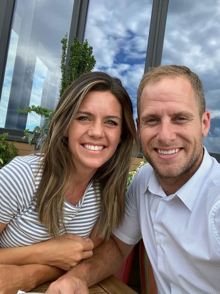 Caleb Flynn and his late wife, Ashley Flynn, smiling at the camera.