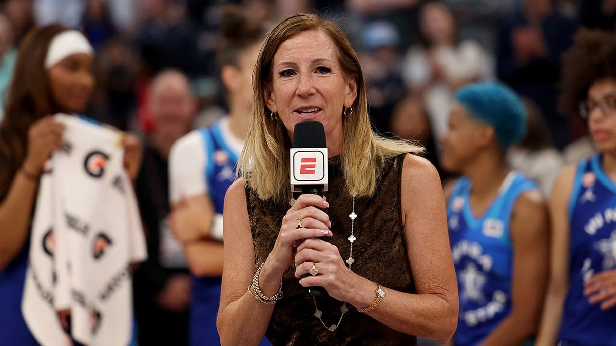 WNBA Commissioner Cathy Engelbert speaks at a podium.