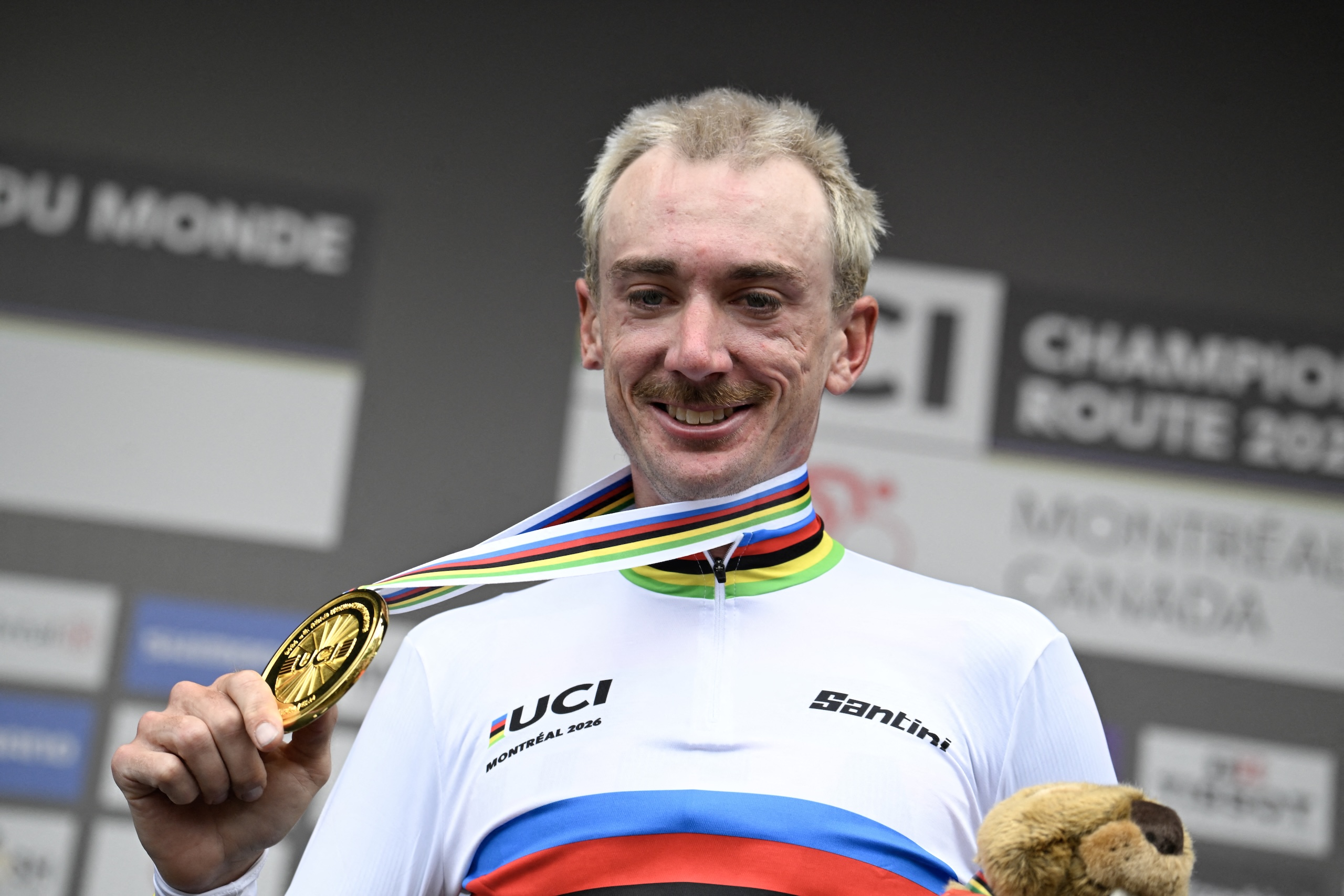 The United States' Brandon McNulty celebrates on the podium after winning the Men Elite Road Race during the 2026 Union Cycliste Internationale (UCI) Road World Championships in Montreal, Quebec, on September 27, 2026. (Photo by Andrej Ivanov / AFP)