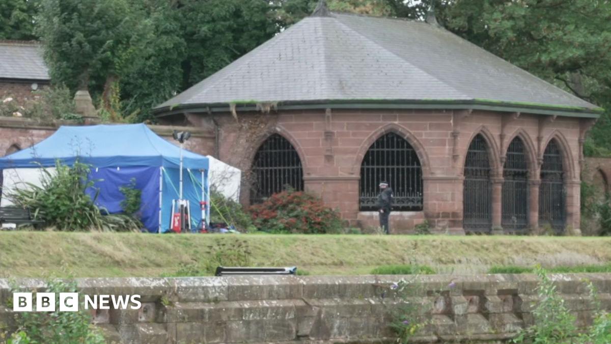 A blue police scenes of crime tent in Stanley Park near the walled garden where the body was found.