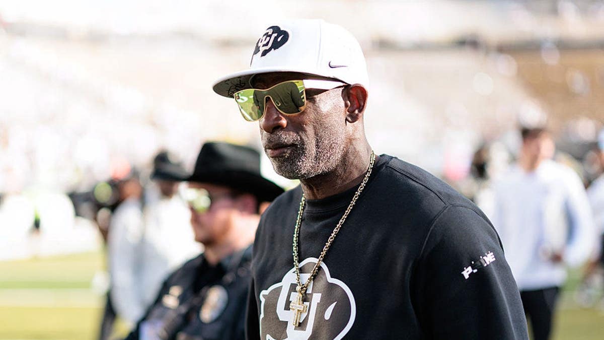 Deion Sanders walks off the field at Folsom Field in Boulder, Colo.