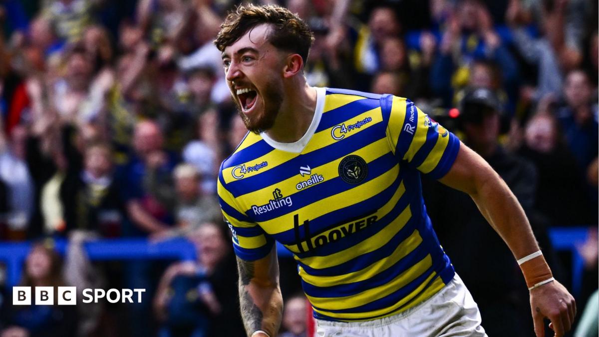 Warrington Wolves winger Matty Ashton, in blue and primrose hoops, shouts in celebration after scoring a try against Hull Kingston Rovers.