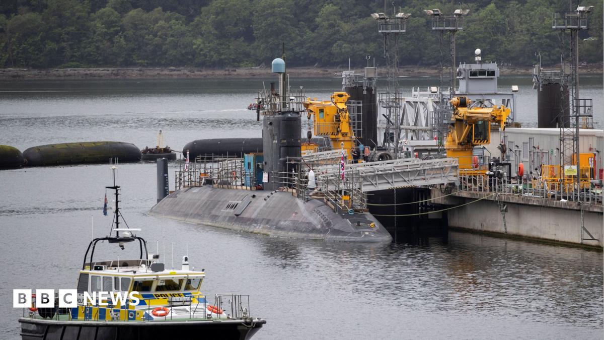 A submarine sitting in the water at Faslane.