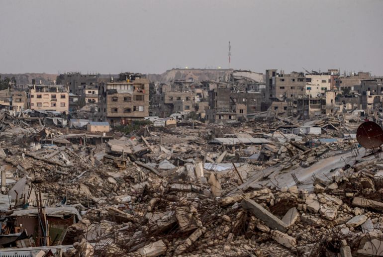 An Israeli military site is seen in the background behind destroyed residential buildings in the al-Sheikh Radwan neighbourhood, east of Gaza City, on September 10, 2026