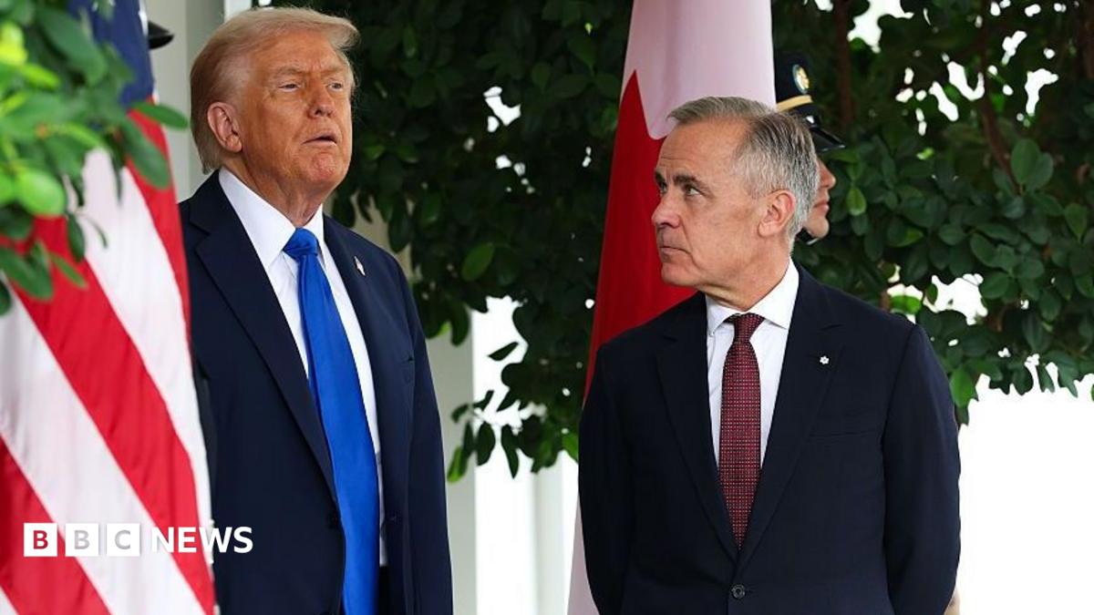 US President Donald Trump speaks to Canadian Prime Minister Mark Carney  during a welcome outside the West Wing of the White House in October 2025