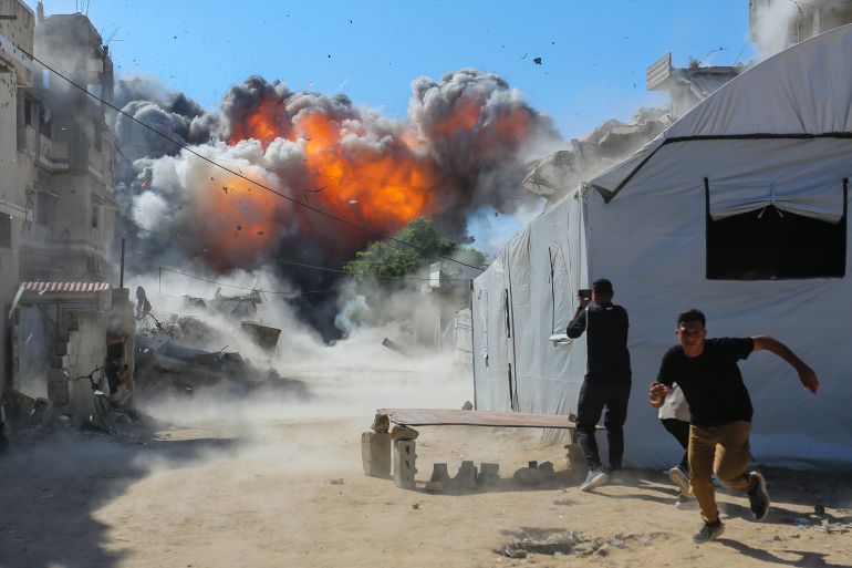 GAZA CITY, GAZA - JULY 12: (EDITOR'S NOTE: Alternative crop of image #2285764770) Smoke from an explosion can be seen after an Israeli attack on July 12, 2026 in Gaza City, Gaza. An Israeli attack on an industrial area west of Gaza City has injured a number of Palestinians, according to witnesses. Israel has continued to bomb Gaza despite the US-brokered ceasefire deal, accusing Hamas of rearming and rebuilding its forces.  (Photo by Ahmad Hasaballah/Getty Images)