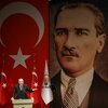 Turkish President Recep Tayyip Erdogan addresses a meeting of provincial election officials in front of a giant portrait of him and one of Mustafa Kemal Ataturk, the founder of modern Turkey, in Ankara on January 29, 2019.