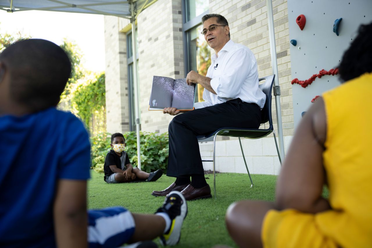 Health and Human Services Secretary Xavier Becerra reads a book to children in the Head Start early childhood education program at Martha's Table at The Commons on June 30, 2021 in Washington, DC.