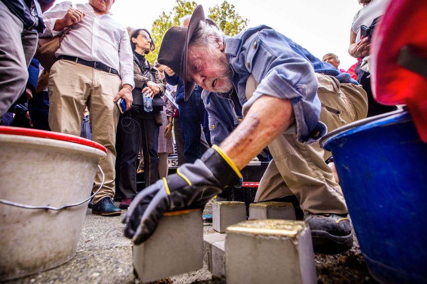 Artist Gunter Demnig, pictured laying 'Stolpesteine' in memory of Nazi victims, has condemned the recent development.
