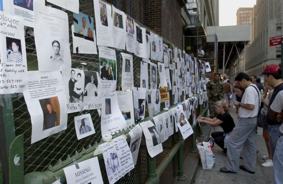 Friends and family of missing people post signs with photos and descriptions of loved ones in New York City on September 13, 2001.