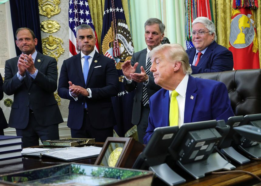 US Rep. Juan Ciscomani (R-AZ), second from left, applauds after U.S. President Donald Trump delivered remarks during a