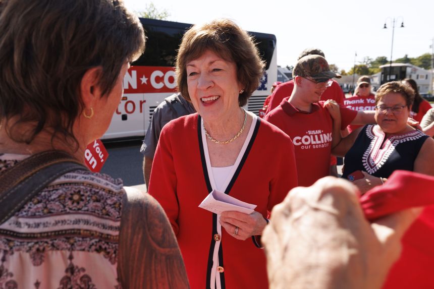 US Sen. Susan Collins (R-ME) greets supporters outside the Kittery Trading Post, the first stop of a weekend re-election campaign bus tour of the state of Maine, on August 14.