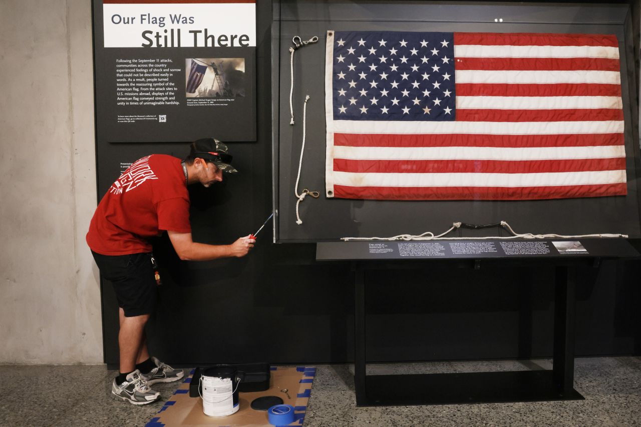 A worker makes last-minute adjustments to an exhibition at the 9/11 Memorial Museum in New York on September 1.