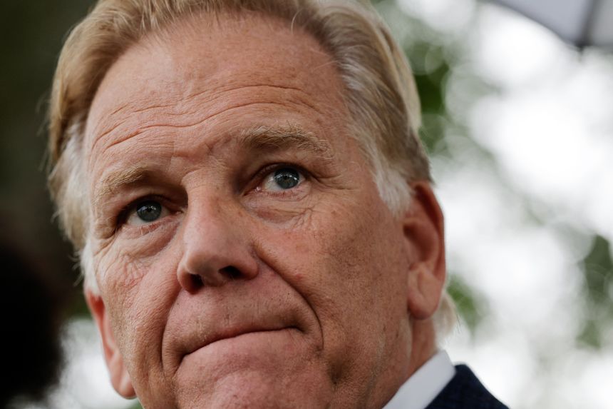 Mike Rogers talks to reporters outside of Cody High School in Detroit, Michigan, after meeting with volunteer tutors on September 9.