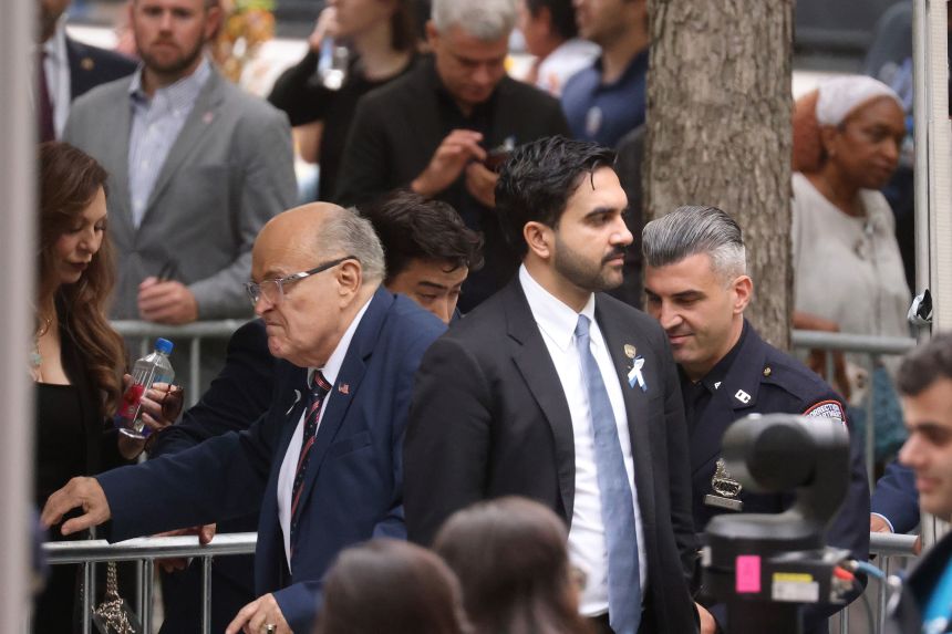 Zohran Mamdani, mayor of New York, center right, and Rudy Giuliani, former mayor of New York, center left, arrive ahead of the 25th anniversary commemoration ceremony at the National 9/11 Memorial and Museum in New York on Friday.