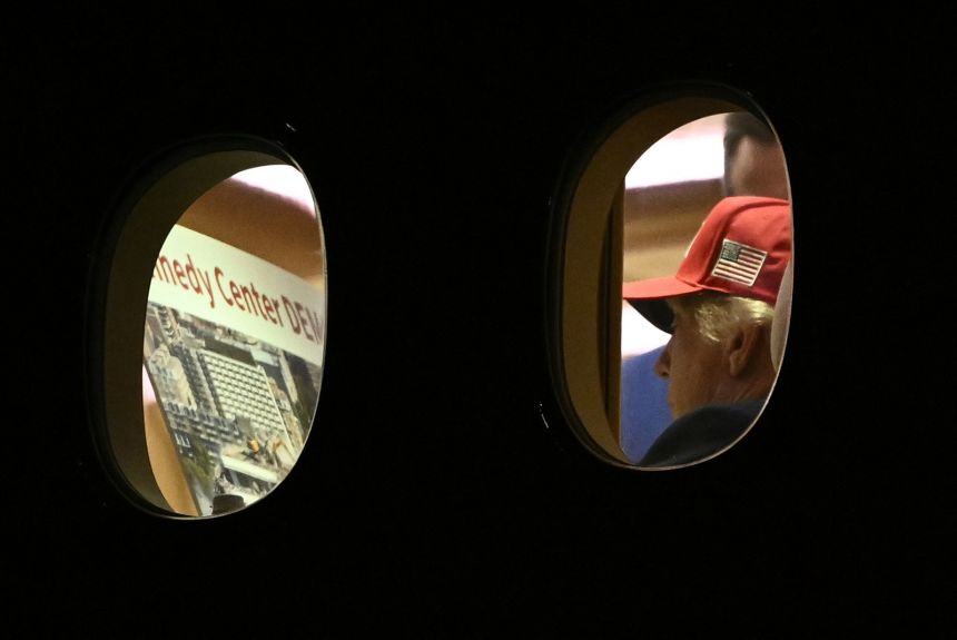US President Donald Trump is seen aboard Air Force One checking a Kennedy Center large printout after landing at Joint Base Andrews, Maryland on September 16, 2026.