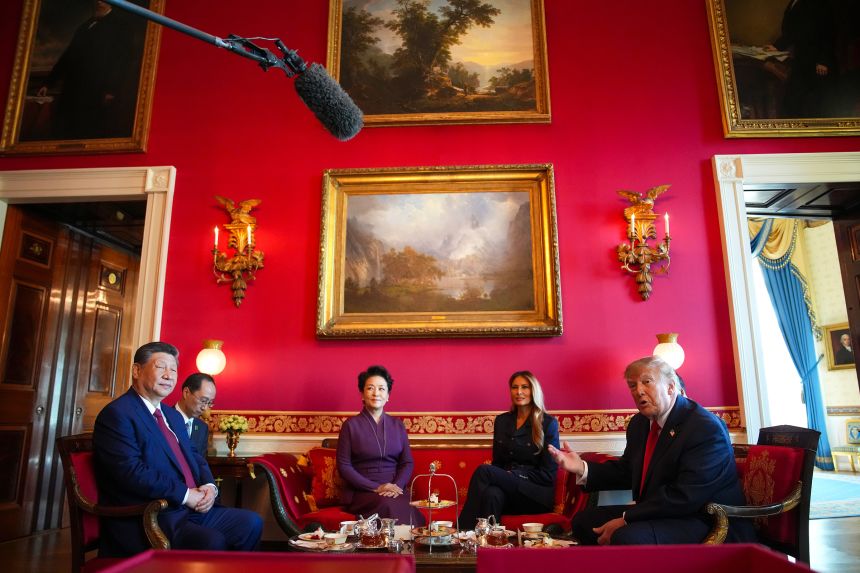 US President Donald Trump speaks during a tea ceremony with President of China Xi Jinping, first lady of China Peng Liyuan and first lady Melania Trump in the Red Room of the White House on September 25.