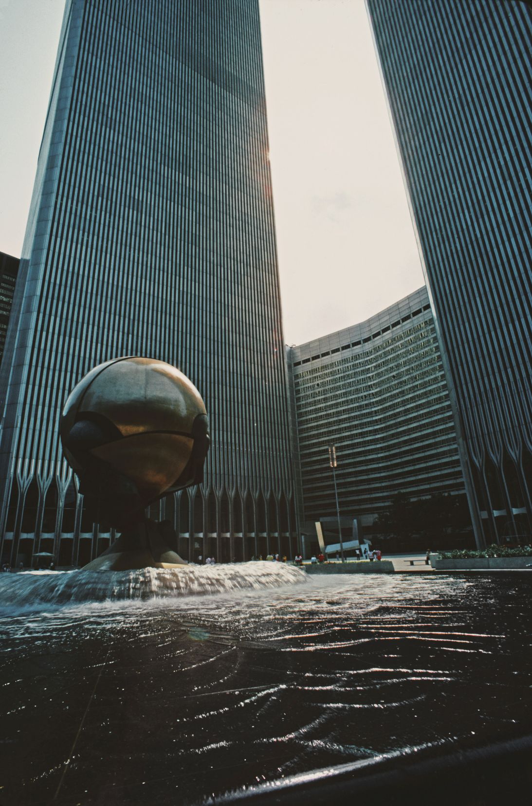 'The Sphere' sculpture sits in the center of the fountain between the World Trade Center towers, New York City, June 1984.