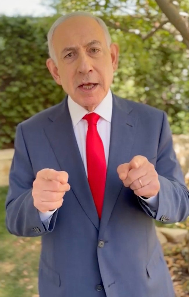 Benjamin Netanyahu pointing to the camera in a video message.