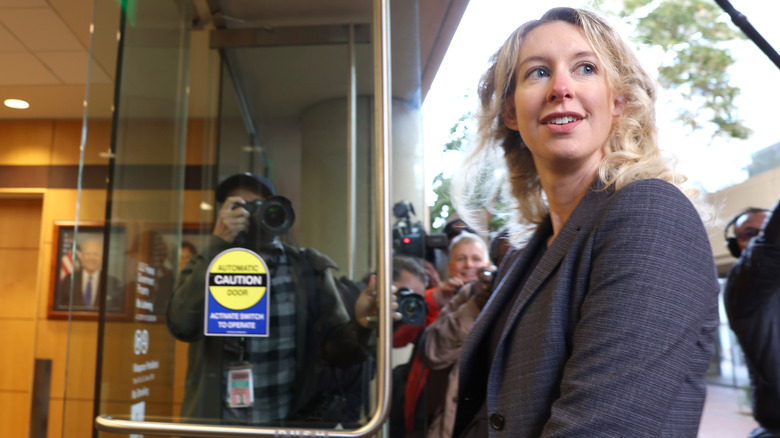 Elizabeth Holmes entering a building.
