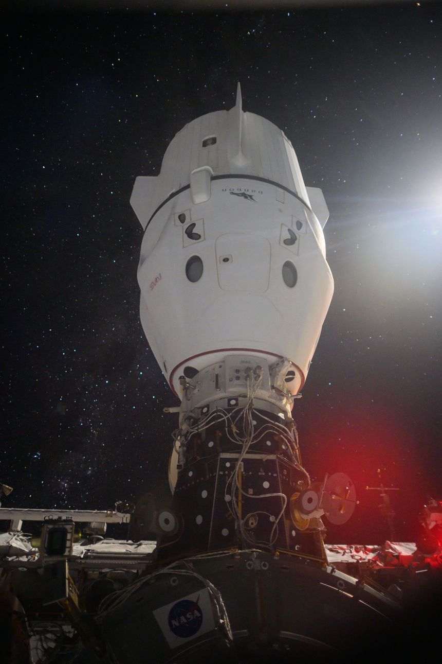 The SpaceX Dragon Endeavour spacecraft is pictured docked to the zenith port of the International Space Station's Harmony module as the orbiting complex soared 265 miles above the Indian Ocean.