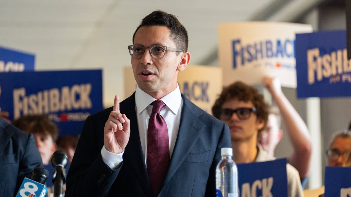James Fishback and Sean Lozano stand together at a press conference.
