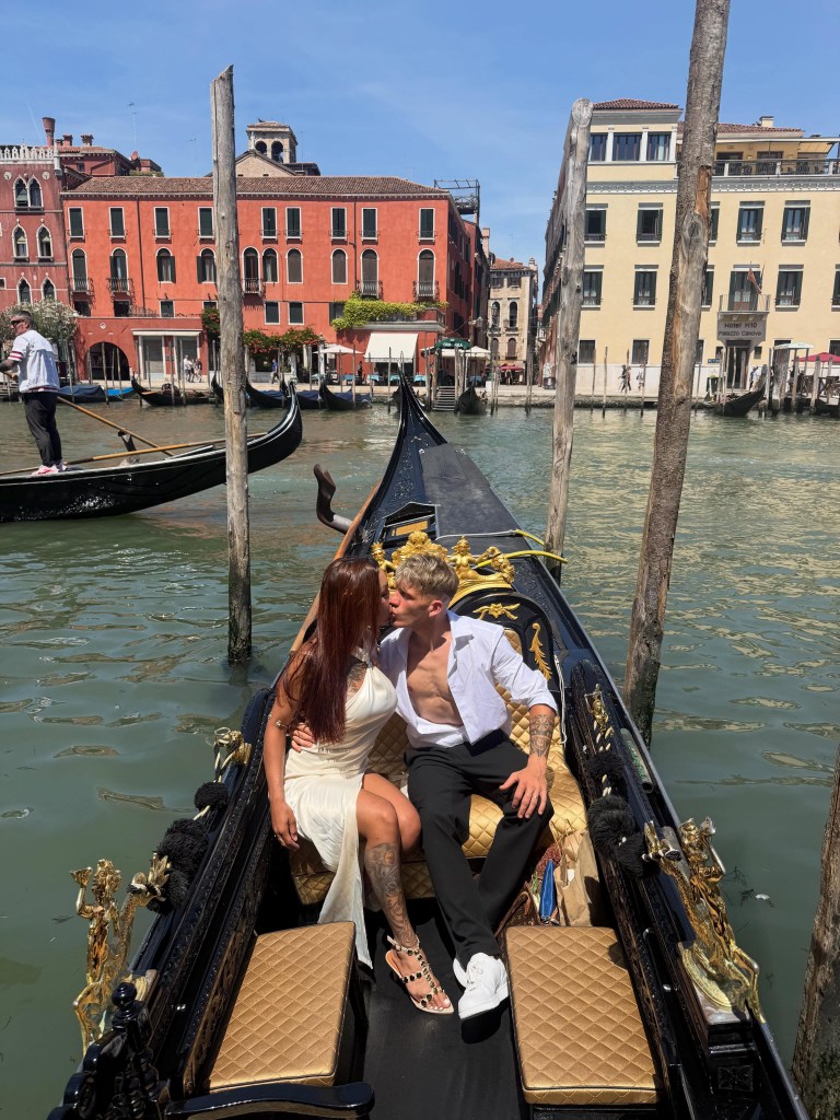 Gabriella Querino and Sean Michieli kiss in a gondola in Venice.
