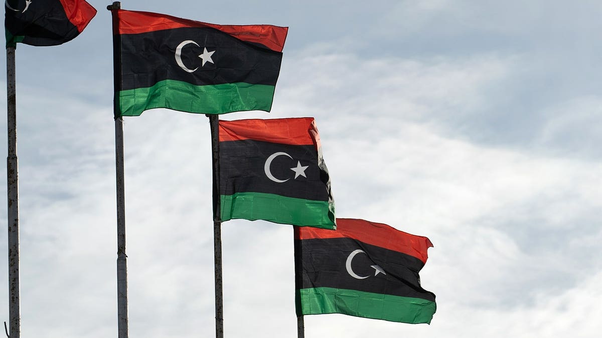 The flag of Libya featuring Pan-Arab colors displayed against a plain background.