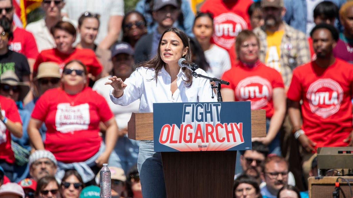 .S. Rep. Alexandria Ocasio-Cortez addresses a crowd at a 