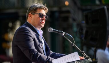 A photo of ofir akunis speaking into a mic.